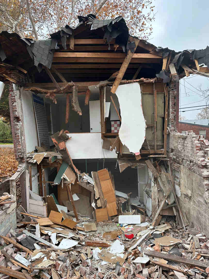 Worker using demolition tools for controlled structural removal in Saint Louis